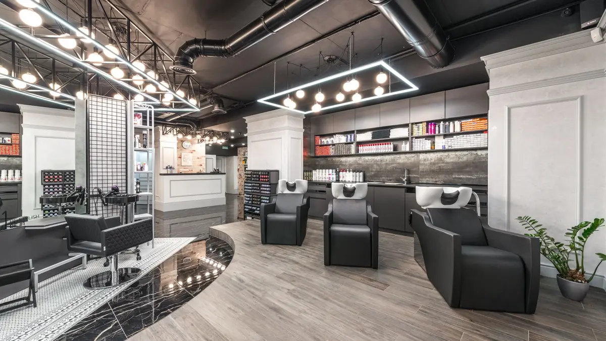 Wide view of the salon with styling chairs and basin chairs